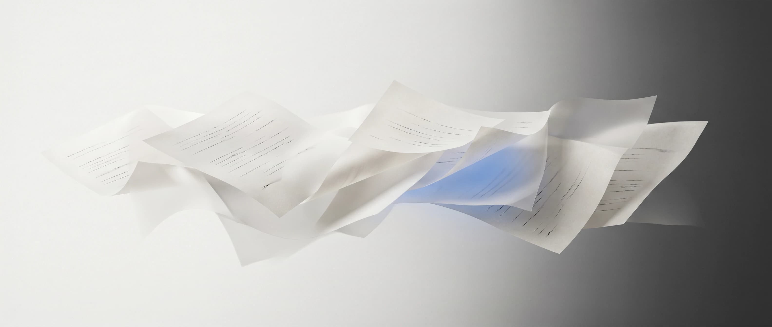 Abstract editorial banner of overlapping translucent paper-like planes