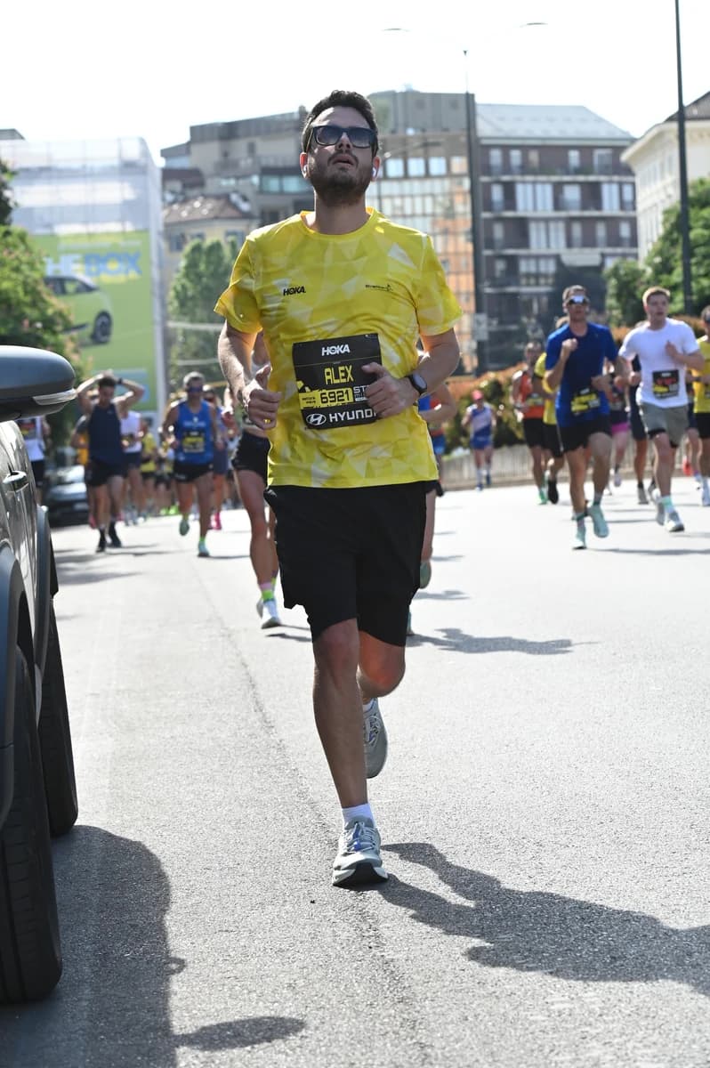 Running uphill at kilometre 18 of the Stramilano half marathon in Milan, slowing down after hitting the wall